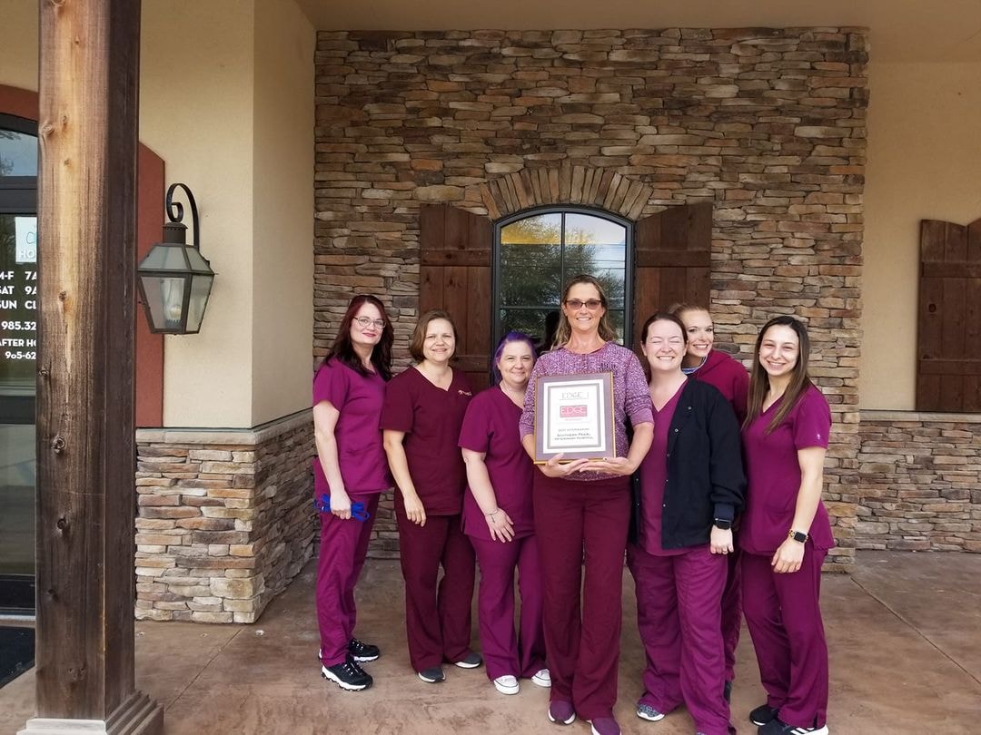Southern Pearl Veterinary Hospital team holding the Northshore Edge Choice Award for Best Vet